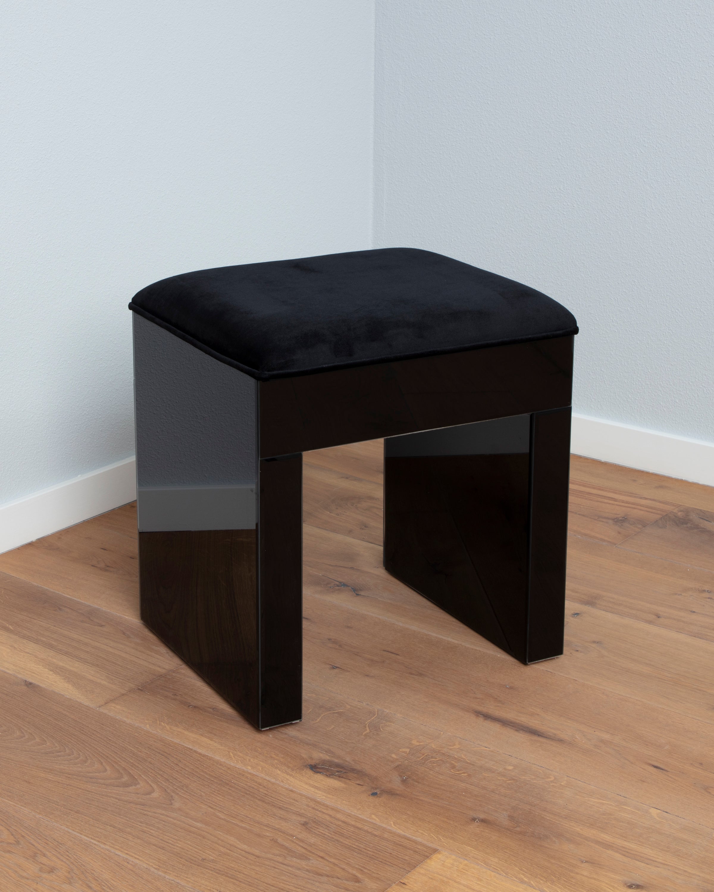 The black vanity stool