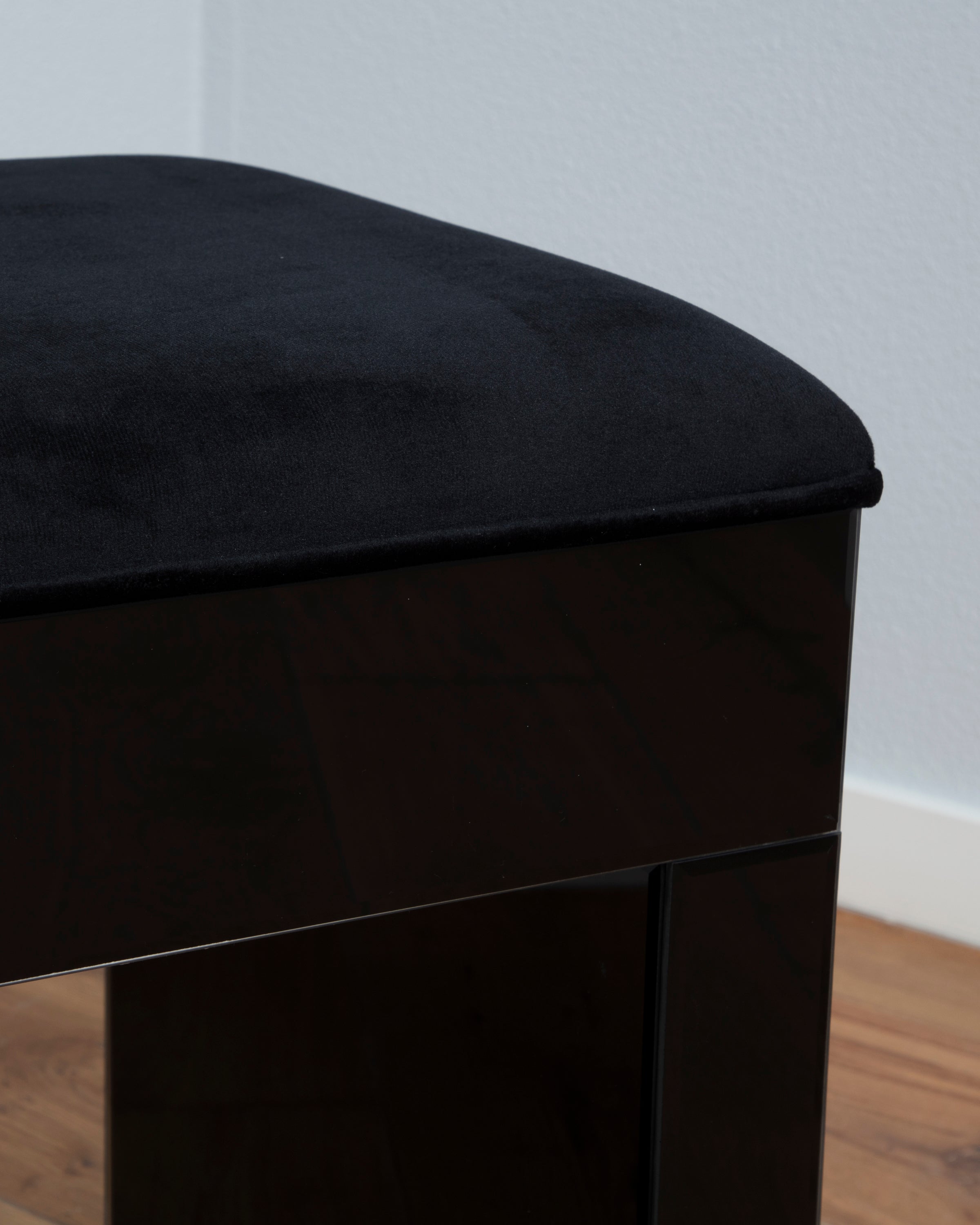 The black vanity stool